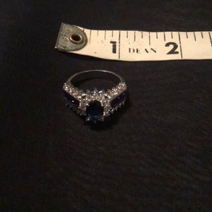 Described on purchase as 14K white gold plated ring with blue CZ